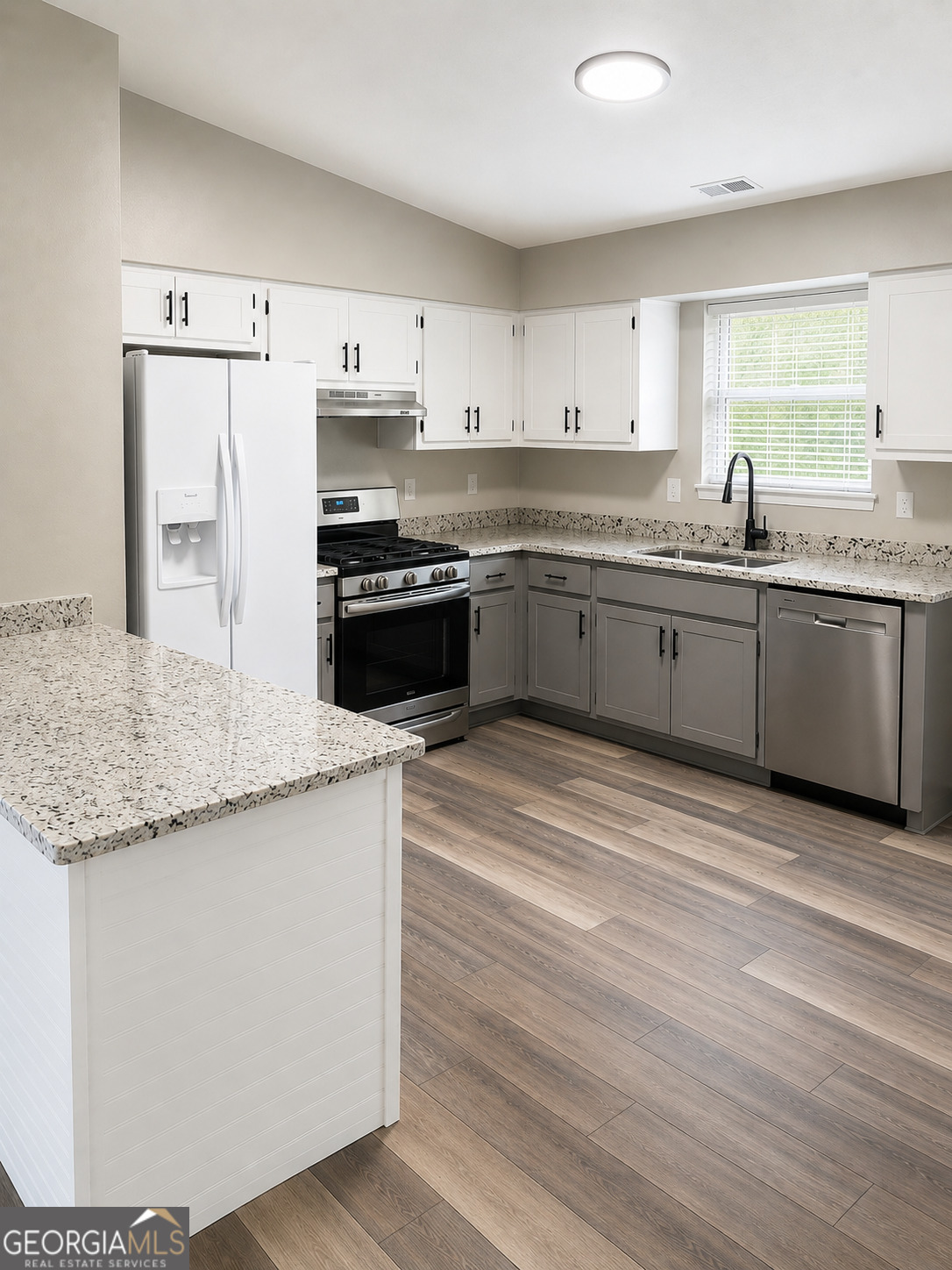 105 Dailey Mill Road McDonough, GA 30253 - Photo 6 of 19 a large kitchen with granite countertop a white stove top oven and white cabinets