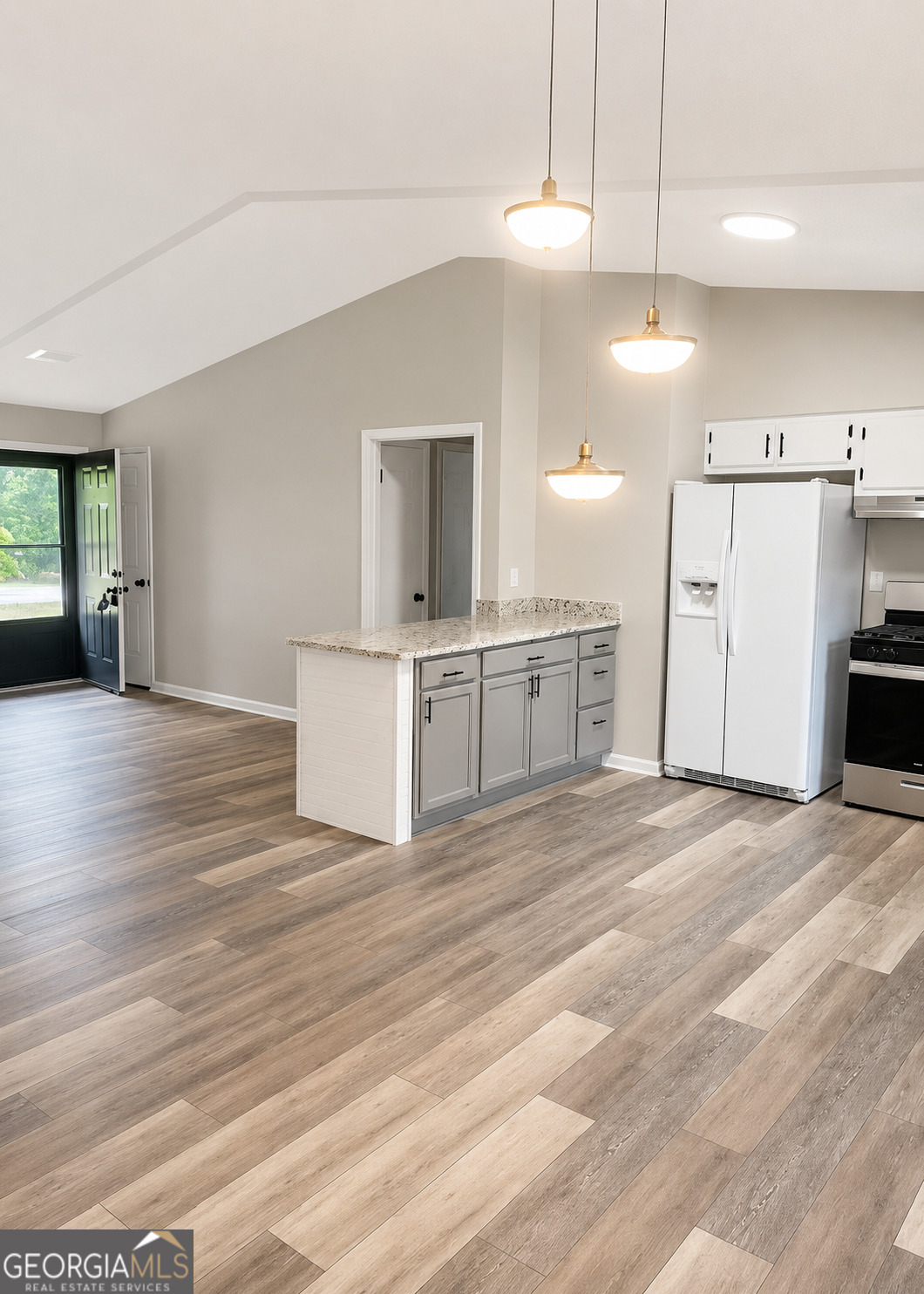 105 Dailey Mill Road McDonough, GA 30253 - Photo 7 of 19 a view of a kitchen with a sink and a stove top oven