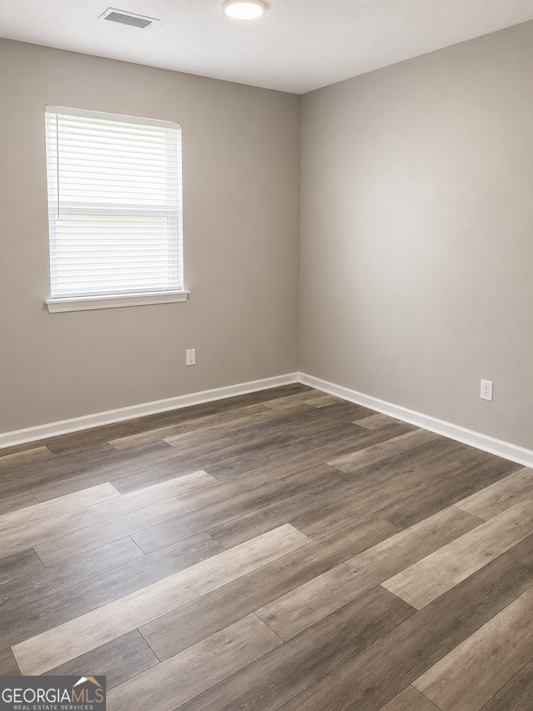 105 Dailey Mill Road McDonough, GA 30253 - Photo 9 of 19 a view of a room with wooden floor and windows