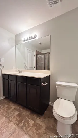 a bathroom with a sink and a toilet