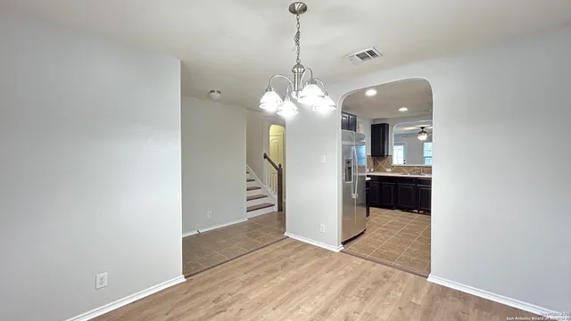 a view of a kitchen and a window