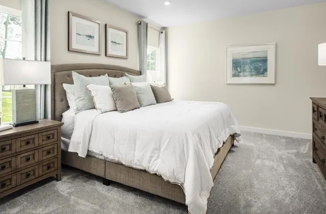 a bed room with a bed and a night stand