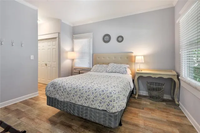 a bedroom with a bed and a cabinets