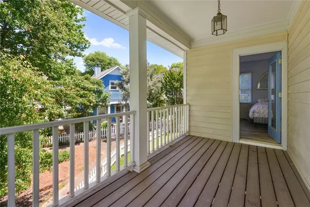 a view of a balcony with wooden floor