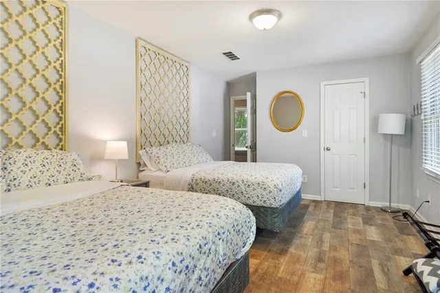 a bedroom with double bed and a window