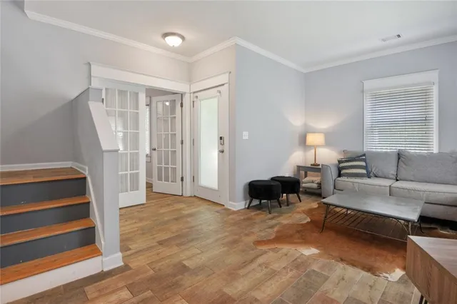a living room with furniture and a lamp