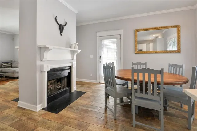 a living room with furniture a fireplace and a table