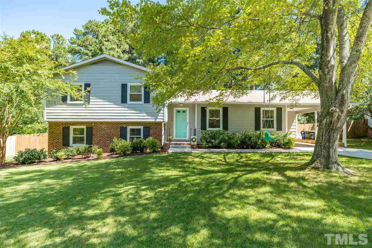 1005 Plateau Lane Raleigh, NC 27615 - Photo 1 of 29 a front view of a house with a yard