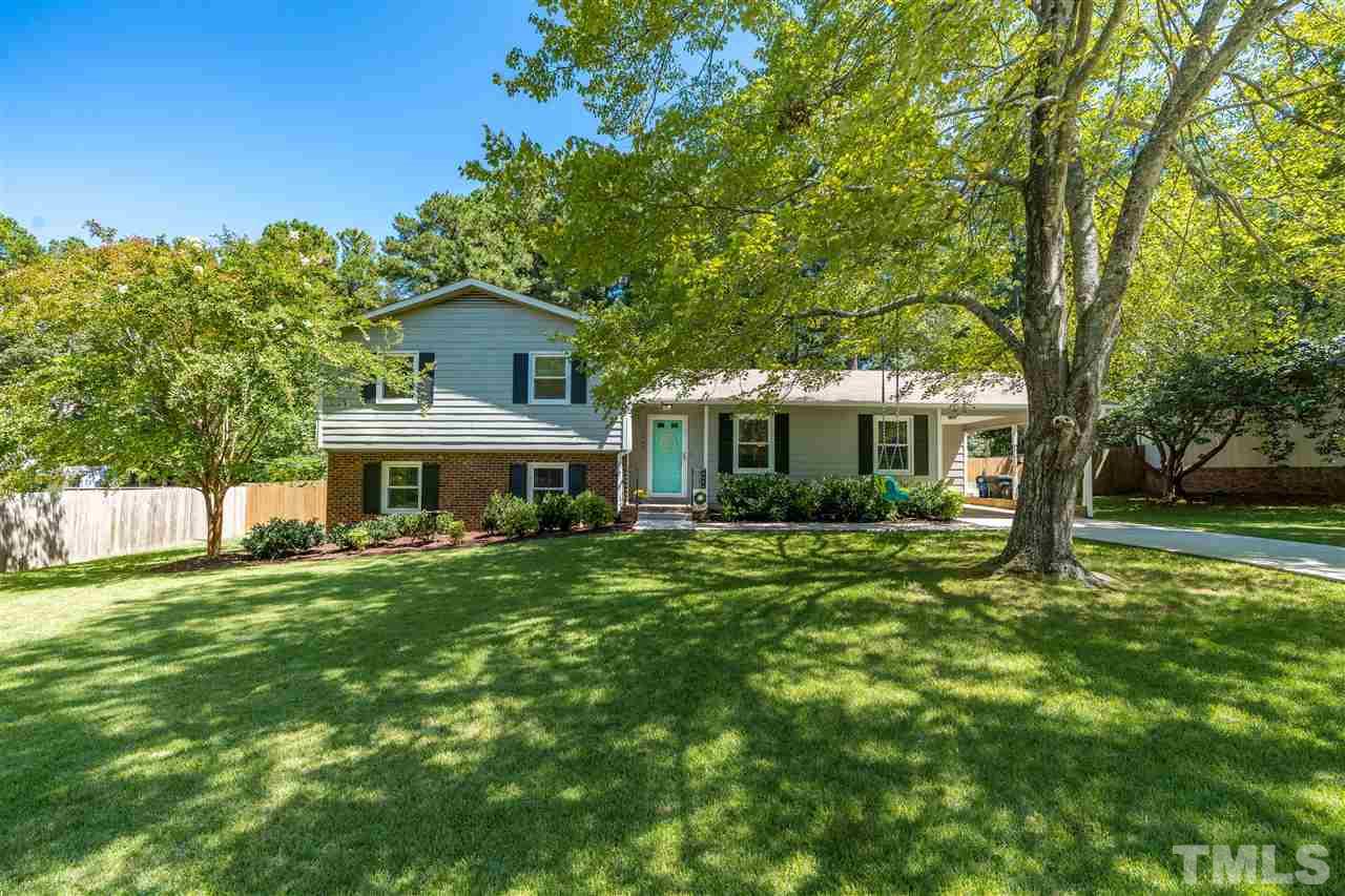 1005 Plateau Lane Raleigh, NC 27615 - Photo 2 of 29 a front view of a house with a garden