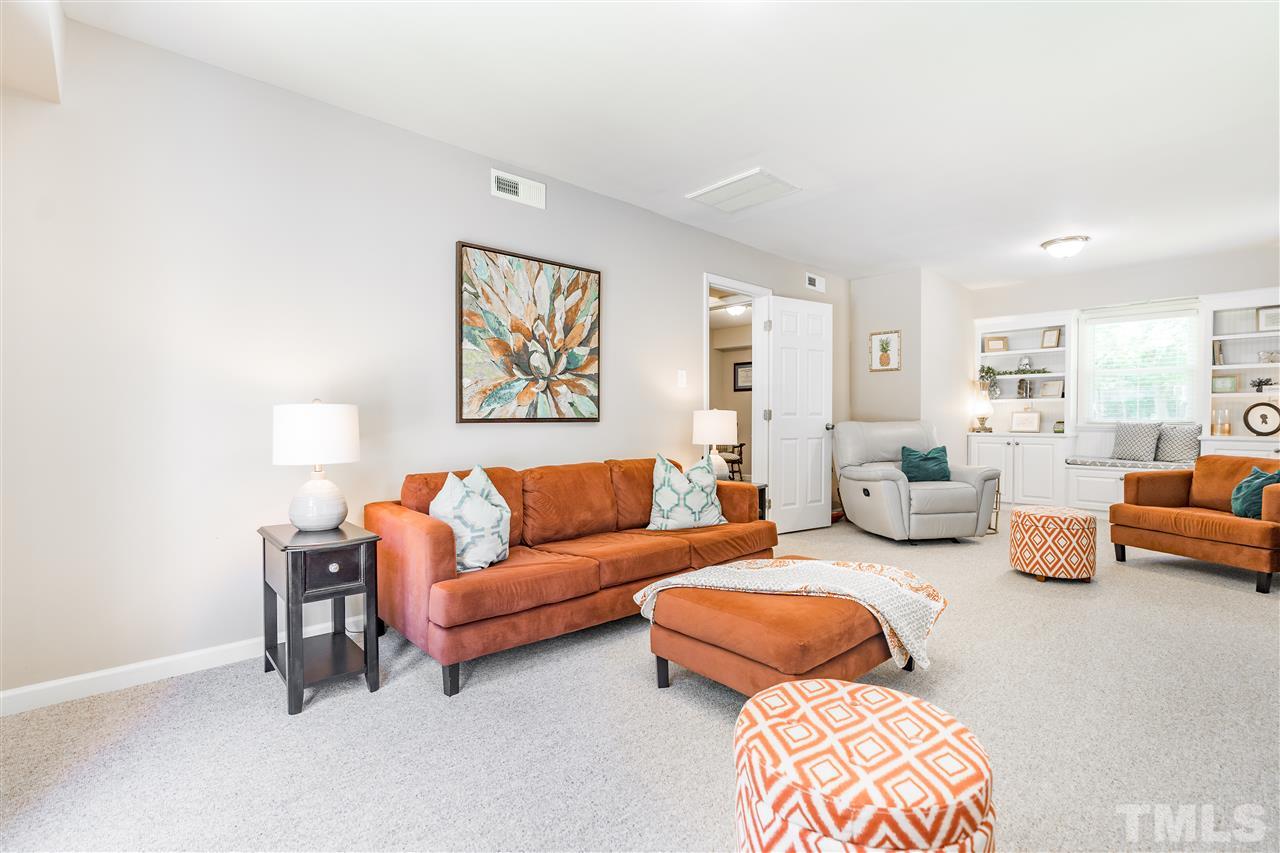 1005 Plateau Lane Raleigh, NC 27615 - Photo 14 of 29 a living room with furniture and a couch