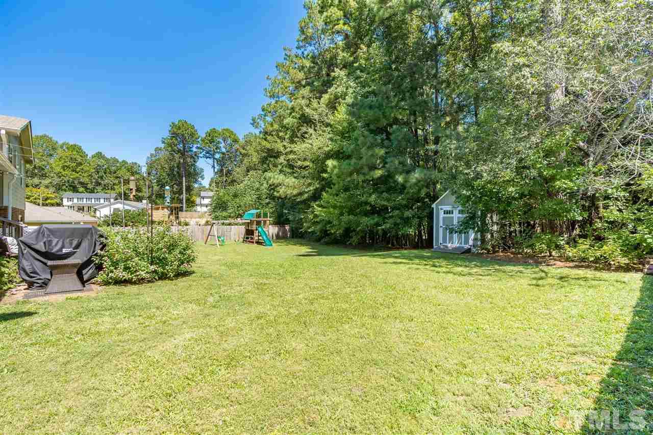 1005 Plateau Lane Raleigh, NC 27615 - Photo 25 of 29 a view of an outdoor space and swimming pool