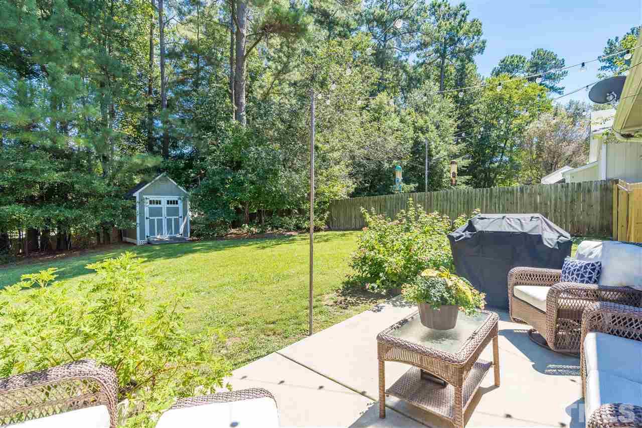 1005 Plateau Lane Raleigh, NC 27615 - Photo 26 of 29 a view of a chairs and table in the patio
