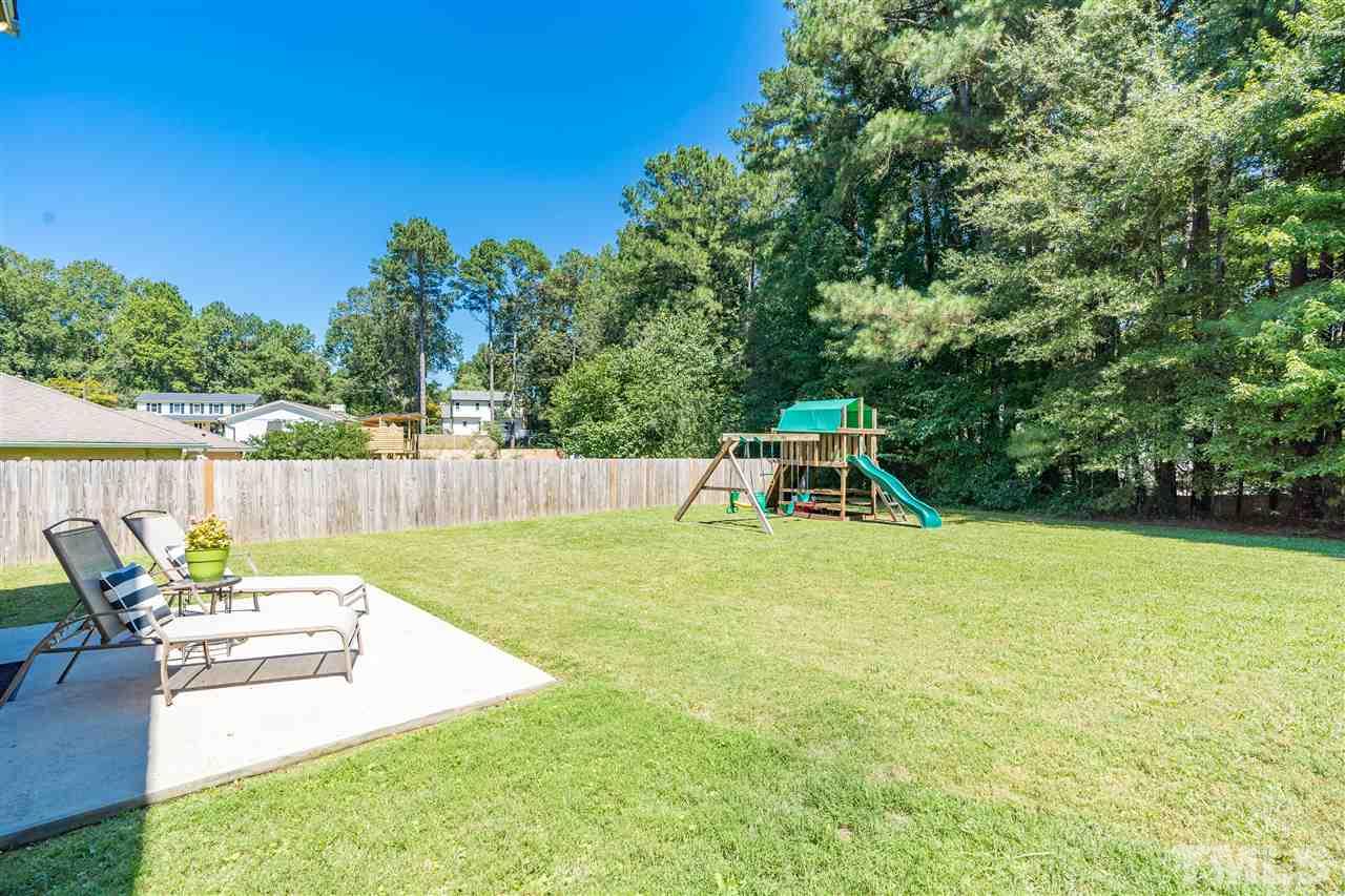 1005 Plateau Lane Raleigh, NC 27615 - Photo 28 of 29 a garden with a wooden fence