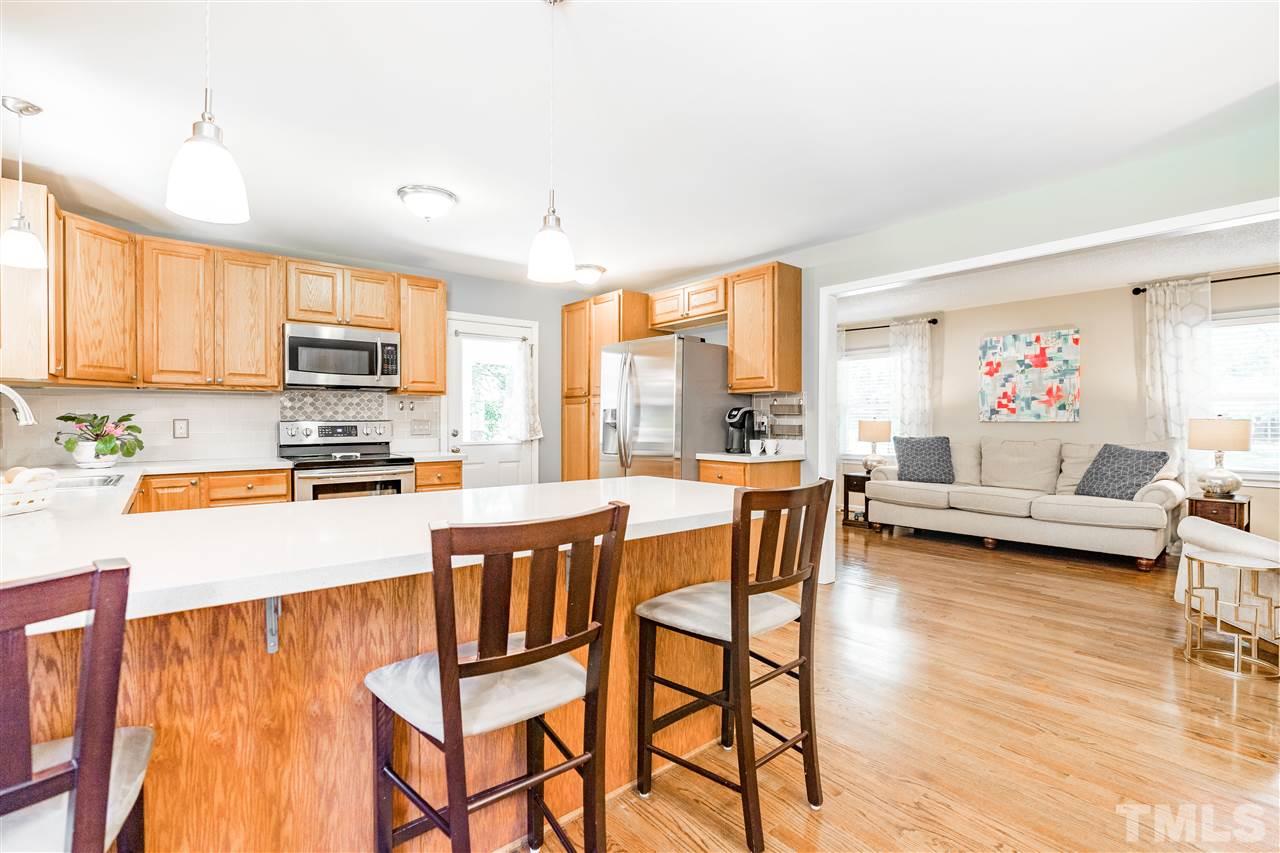 1005 Plateau Lane Raleigh, NC 27615 - Photo 7 of 29 a kitchen with stainless steel appliances a stove a sink dishwasher and a refrigerator