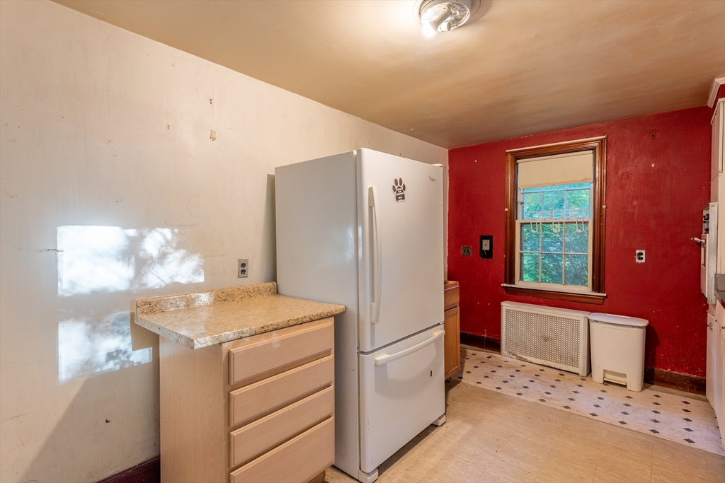 12 Moorland Street Amherst, MA 01002 - Photo 14 of 25 a kitchen with a refrigerator sink and cabinets