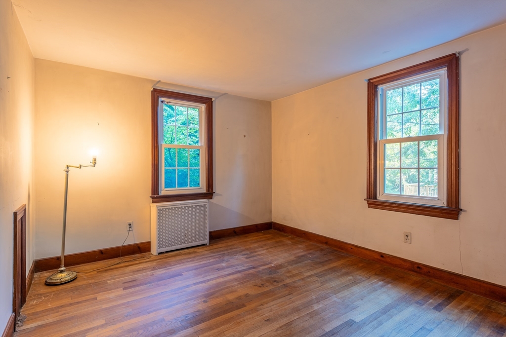 12 Moorland Street Amherst, MA 01002 - Photo 15 of 25 a view of an empty room with wooden floor and a window
