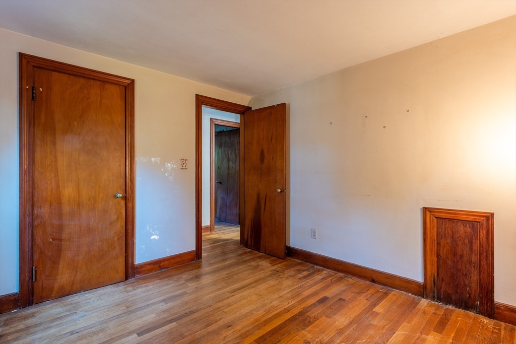 12 Moorland Street Amherst, MA 01002 - Photo 16 of 25 a view of an empty room with wooden floor and closet