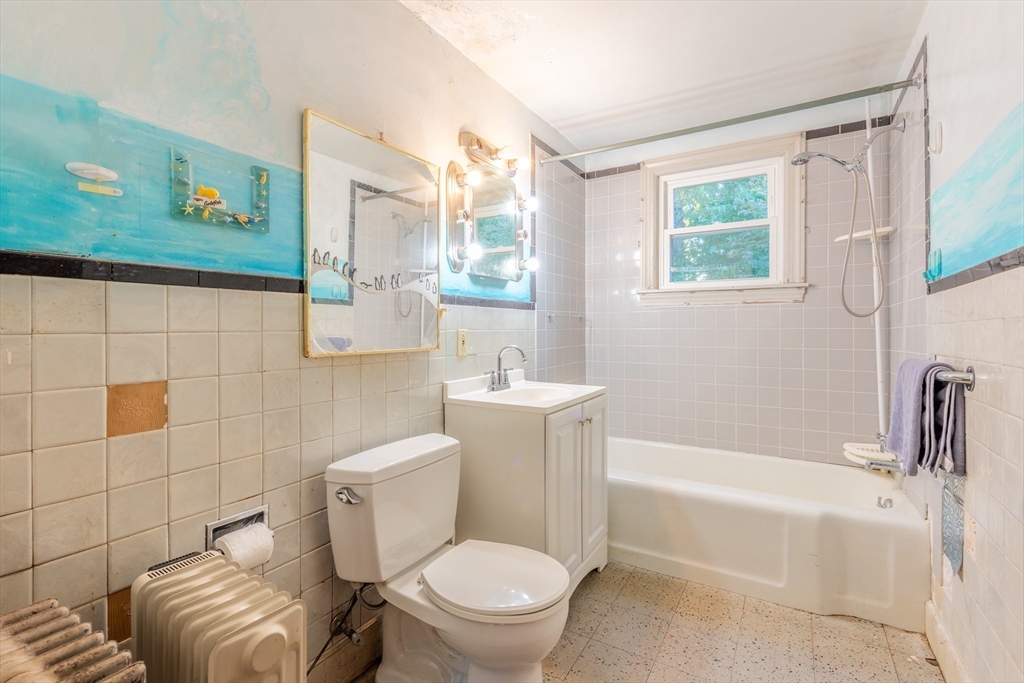 12 Moorland Street Amherst, MA 01002 - Photo 20 of 25 a bathroom with a toilet a sink and a bathtub