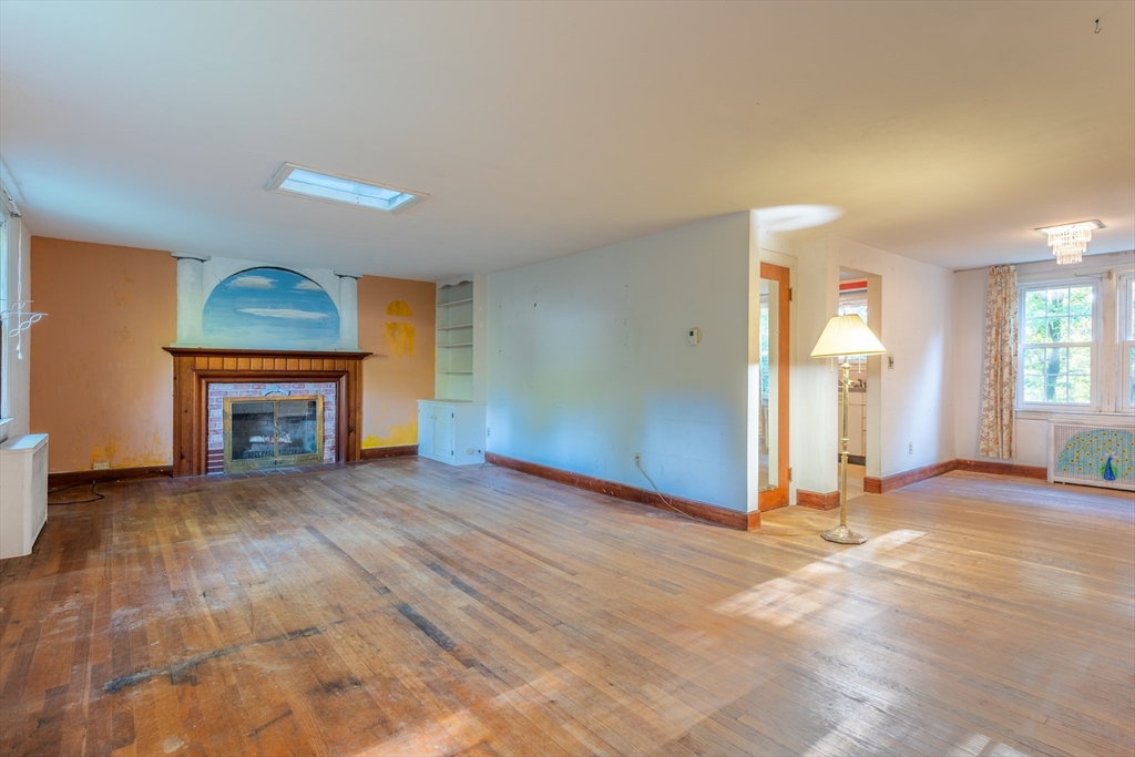 12 Moorland Street Amherst, MA 01002 - Photo 7 of 25 a view of empty room with a fireplace