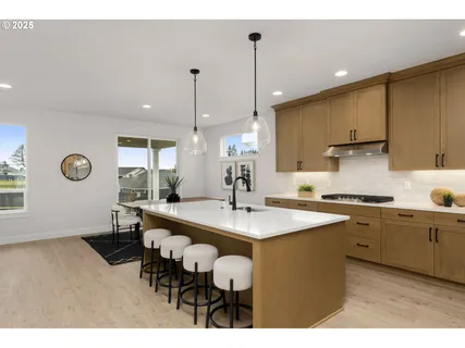 a kitchen with a table and chairs in it