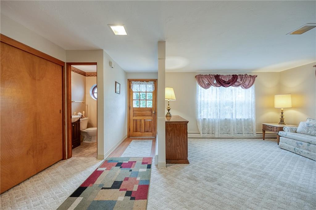1537 Anderson Road Pittsburgh, PA 15209 - Photo 8 of 38 a bedroom with a bed and a couch