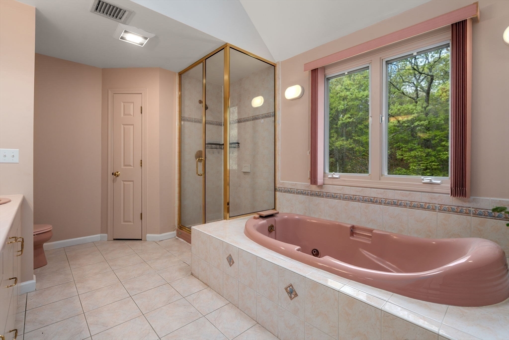 11 Black Elk Road Sharon, MA 02067 - Photo 24 of 28 a spacious bathroom with a tub and shower