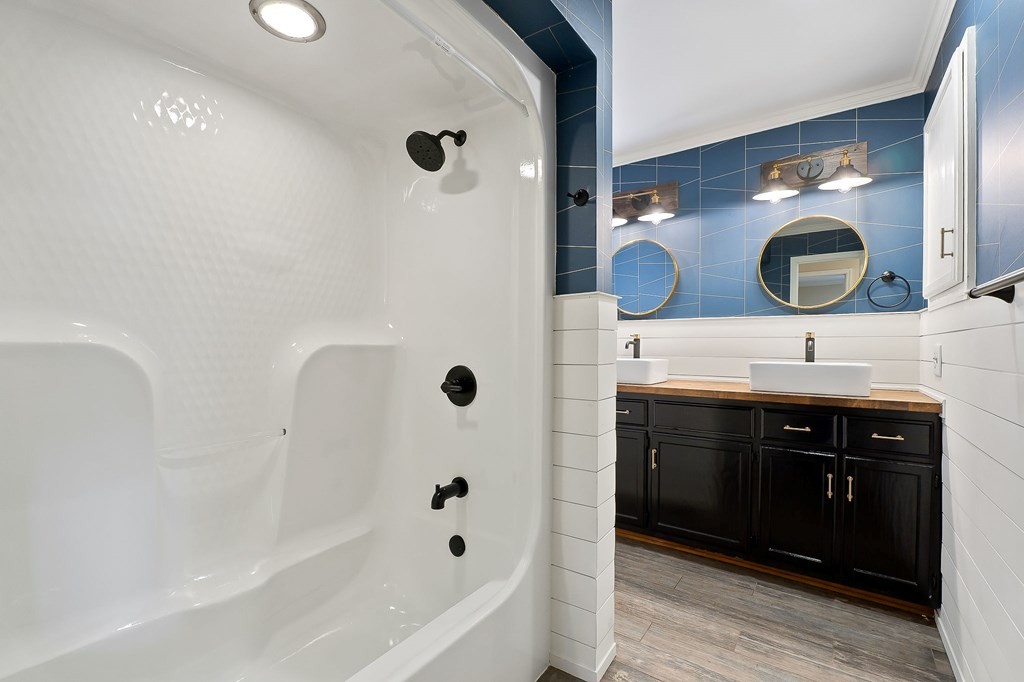 7927 Rocky Point Road Cookeville, TN 38506 - Photo 15 of 26 a bathroom with a sink and a bathtub