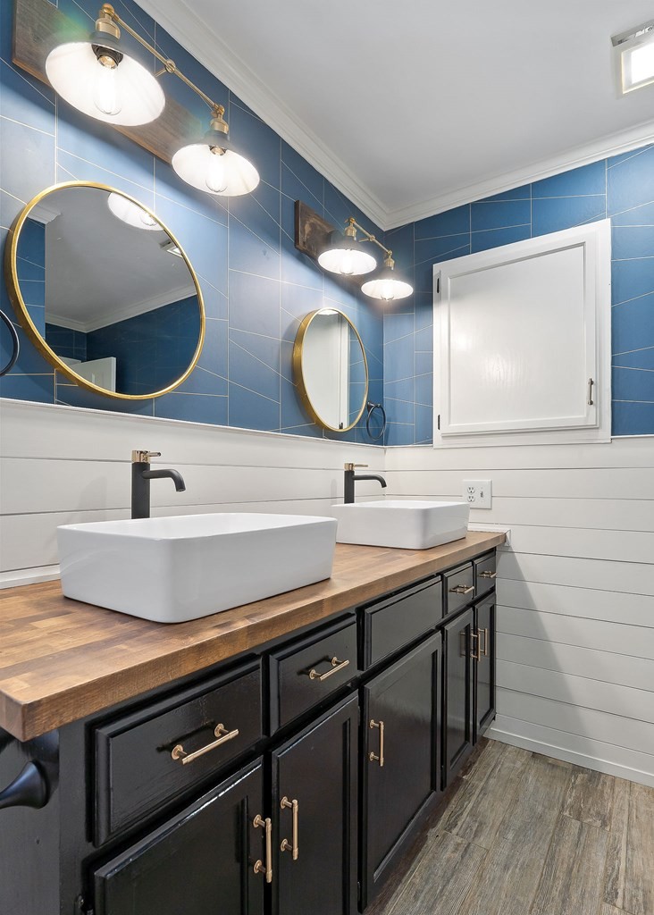 7927 Rocky Point Road Cookeville, TN 38506 - Photo 16 of 26 a bathroom with a double vanity sink and a mirror