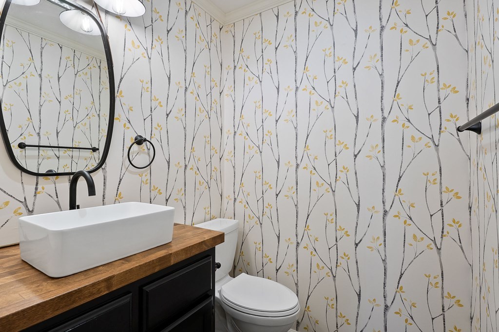 7927 Rocky Point Road Cookeville, TN 38506 - Photo 17 of 26 a bathroom with a toilet and a sink