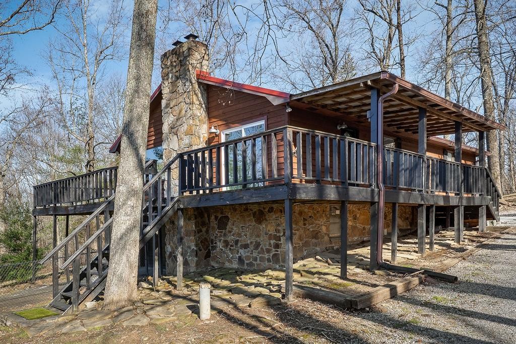 7927 Rocky Point Road Cookeville, TN 38506 - Photo 2 of 26 a view of a house with wooden fence