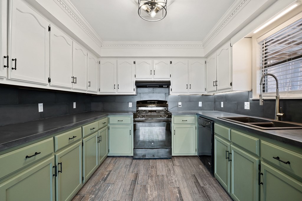 7927 Rocky Point Road Cookeville, TN 38506 - Photo 8 of 26 a kitchen with granite countertop cabinets stainless steel appliances and a sink