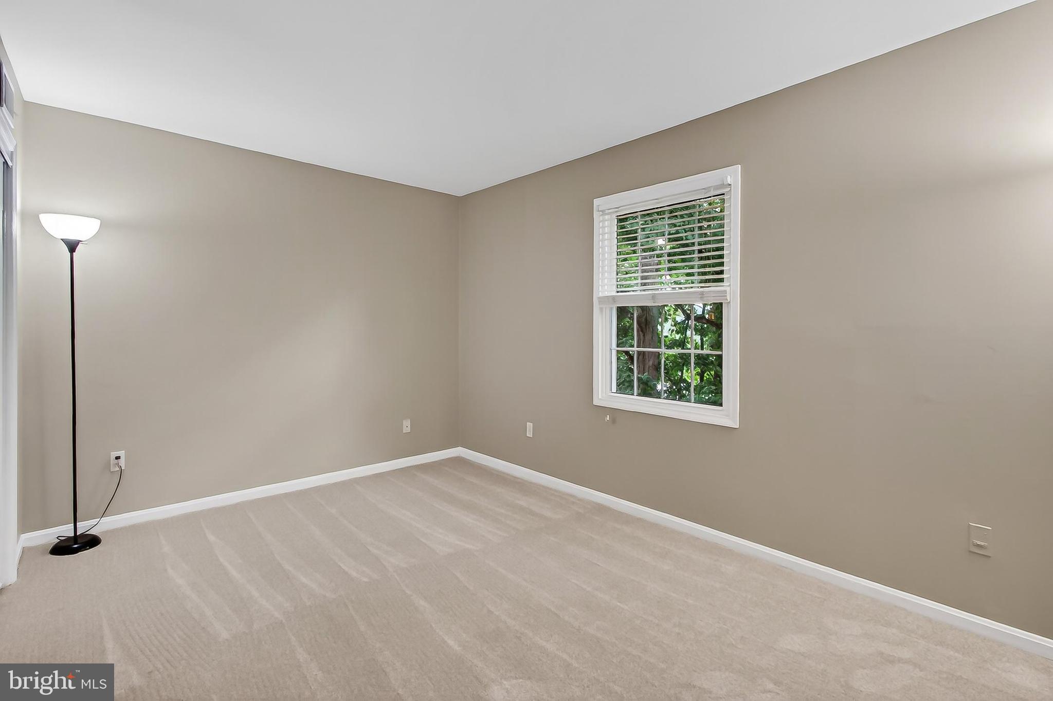 5833 Royal Ridge Drive, Unit 943 Springfield, VA 22152 - Photo 22 of 45 a view of an empty room with a window