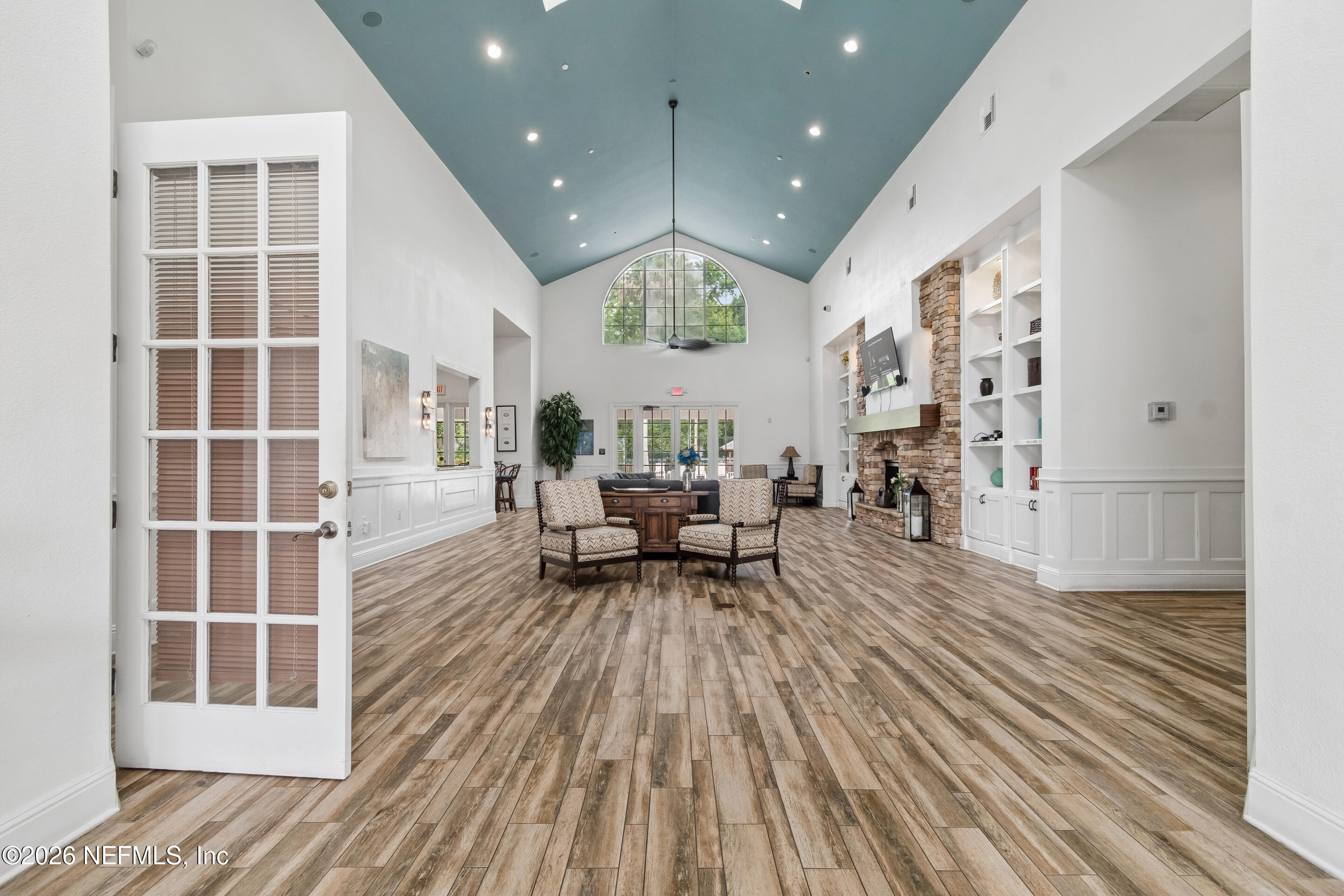 8550 Touchton Road, Unit 511 Jacksonville, FL 32216 - Photo 50 of 63 a living room with furniture and a wooden floor