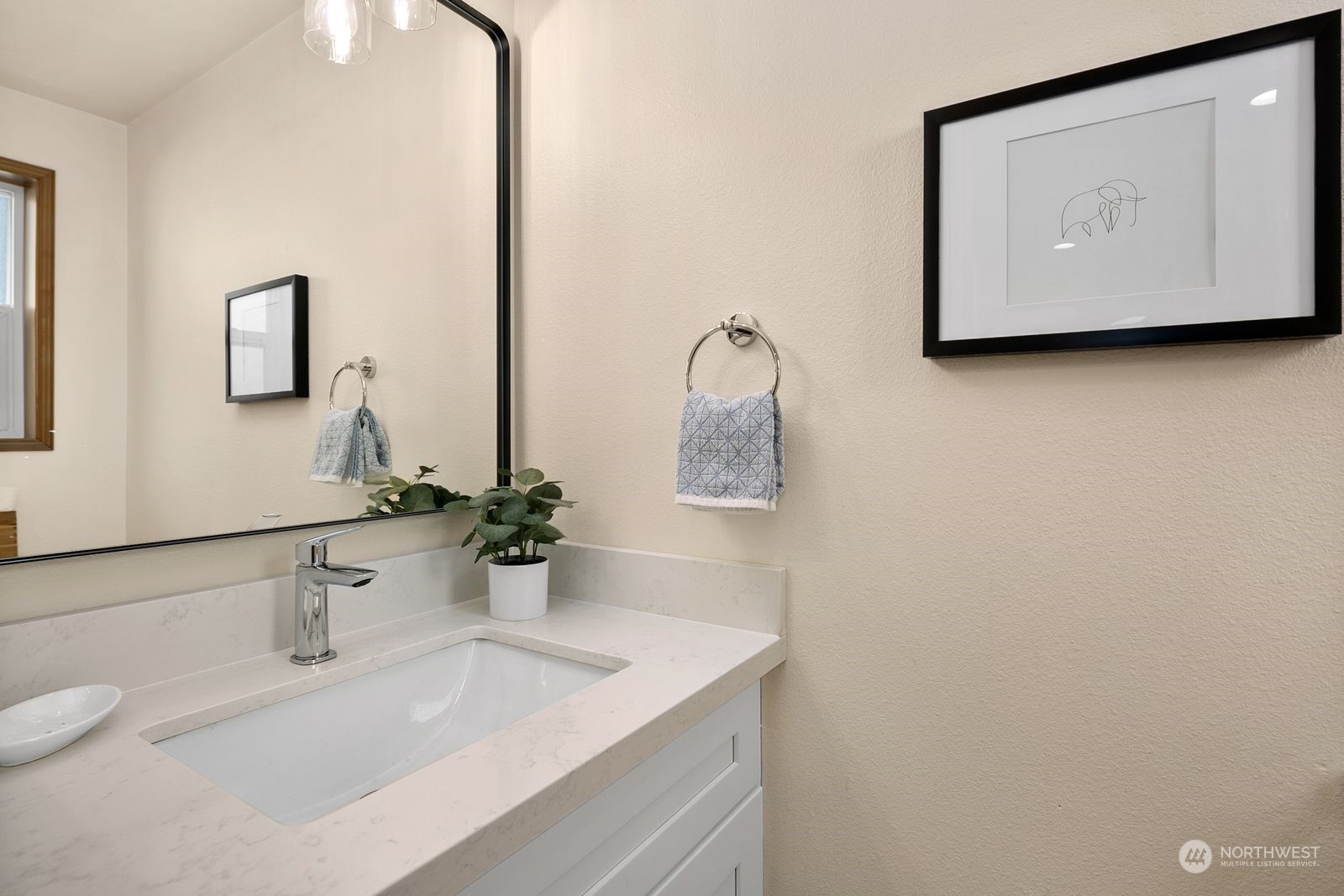 5421 Fauntleroy Way Southwest, Unit A Seattle, WA 98136 - Photo 6 of 18 a bathroom with a sink and a mirror