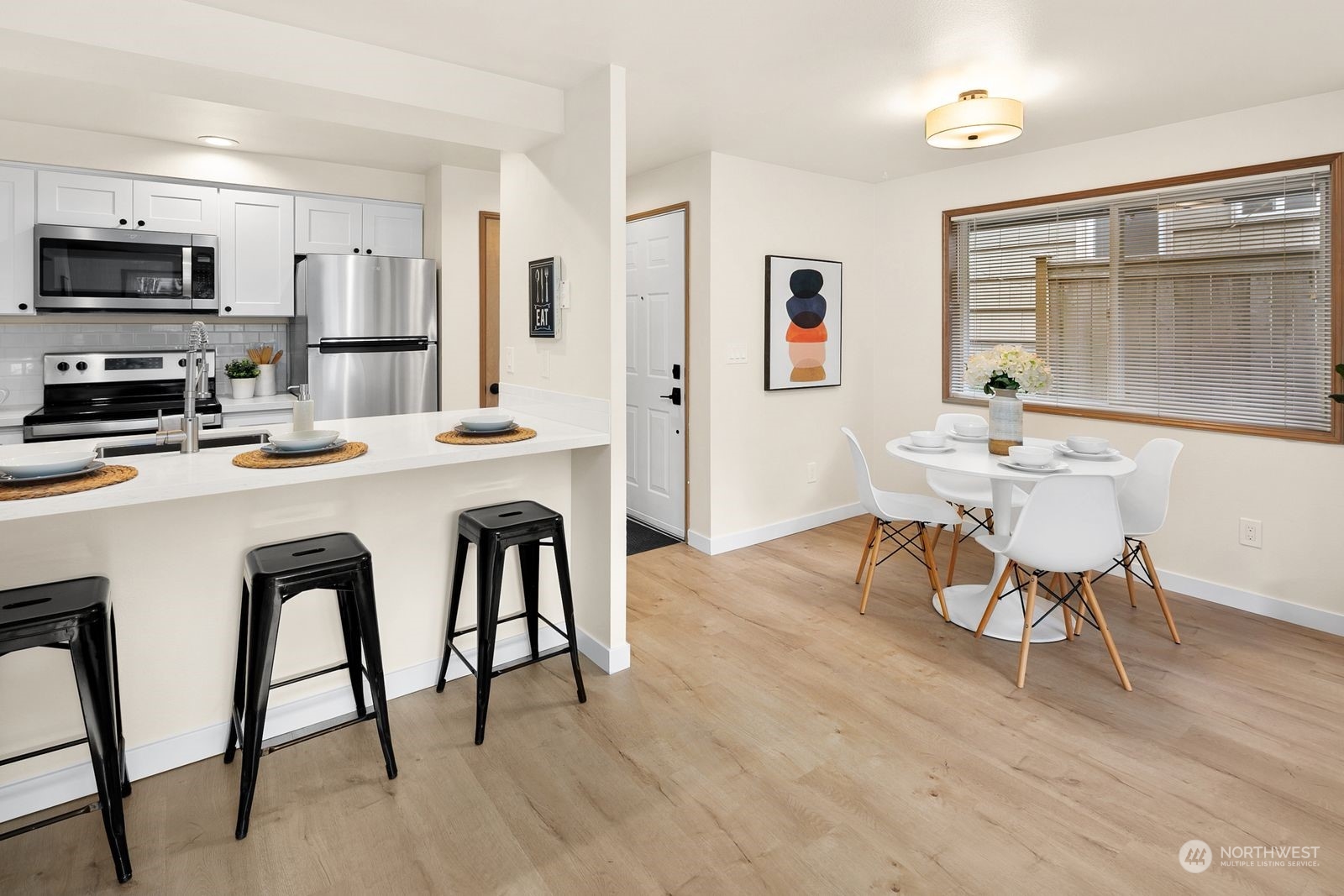 5421 Fauntleroy Way Southwest, Unit A Seattle, WA 98136 - Photo 8 of 18 a dining room with furniture and window