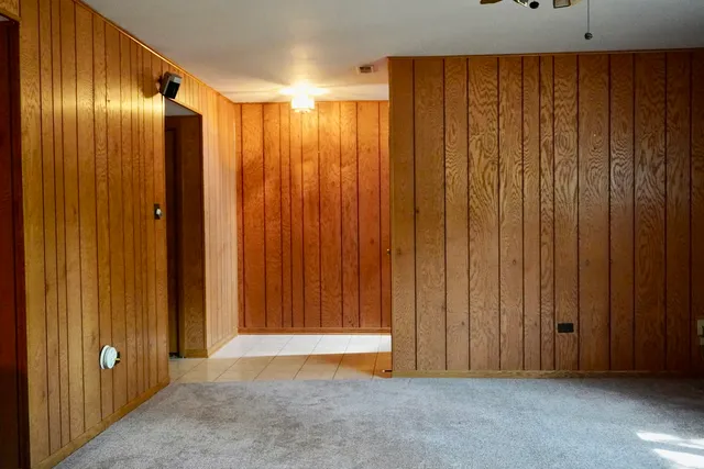 a view of a elevator with wooden walls