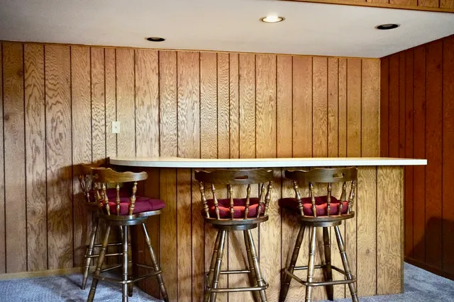 a dinning room with furniture and window