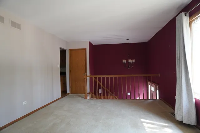 a view of a hallway with staircase