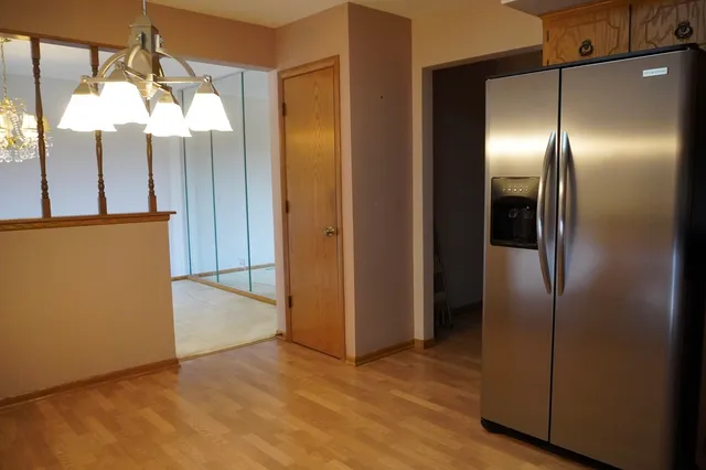 a view of a kitchen with wooden floor