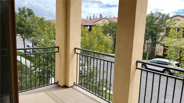 a view of a balcony with wooden floor