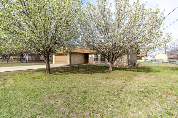 a house with trees in front of it