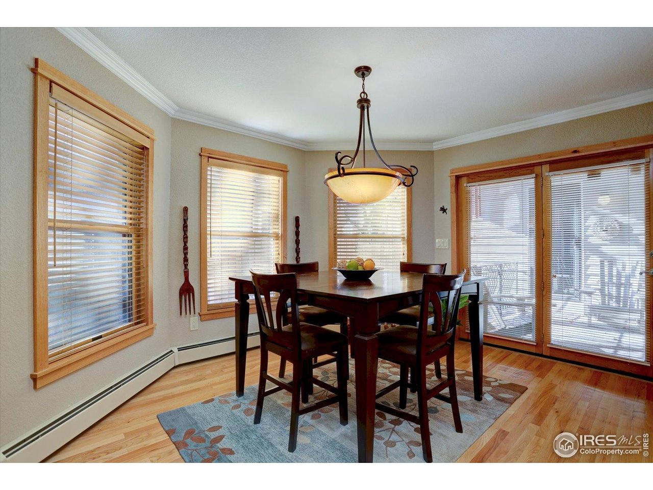815 16th Street Boulder, CO 80302 - Photo 12 of 47 a view of a dining room with furniture window and wooden floor