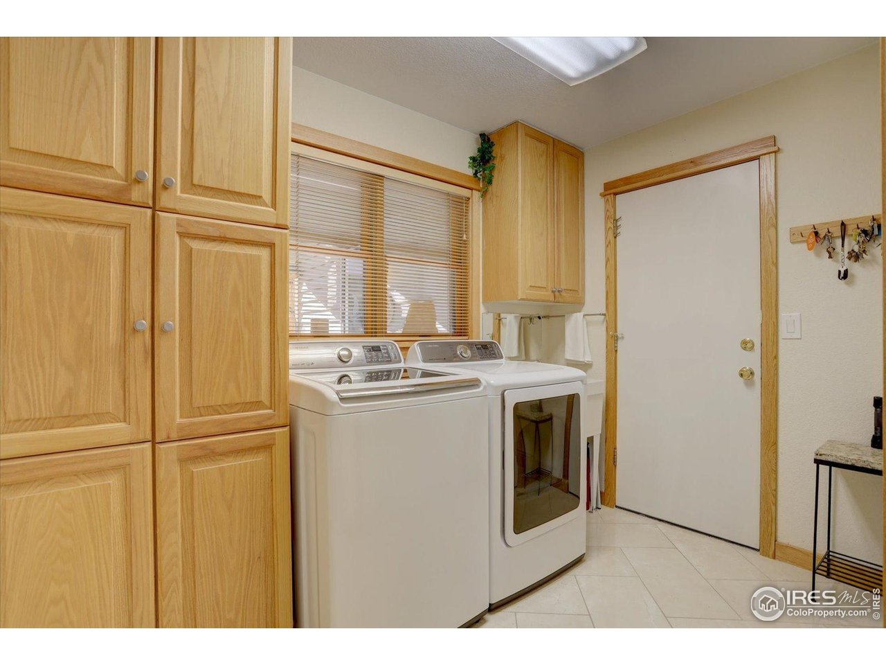 815 16th Street Boulder, CO 80302 - Photo 14 of 47 a kitchen with stainless steel appliances granite countertop a refrigerator a sink and white cabinets