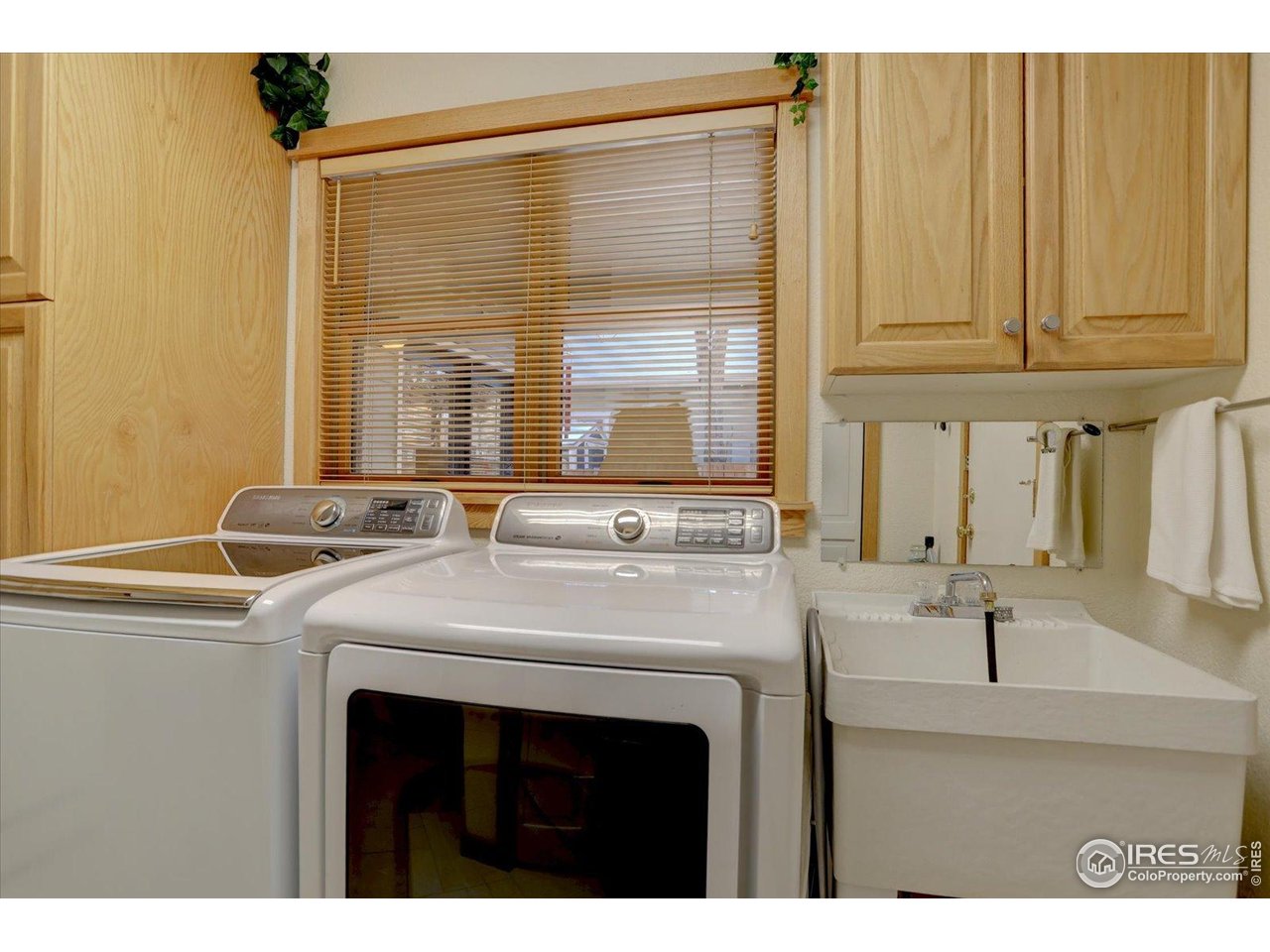 815 16th Street Boulder, CO 80302 - Photo 15 of 47 a kitchen with stainless steel appliances a sink and a large window
