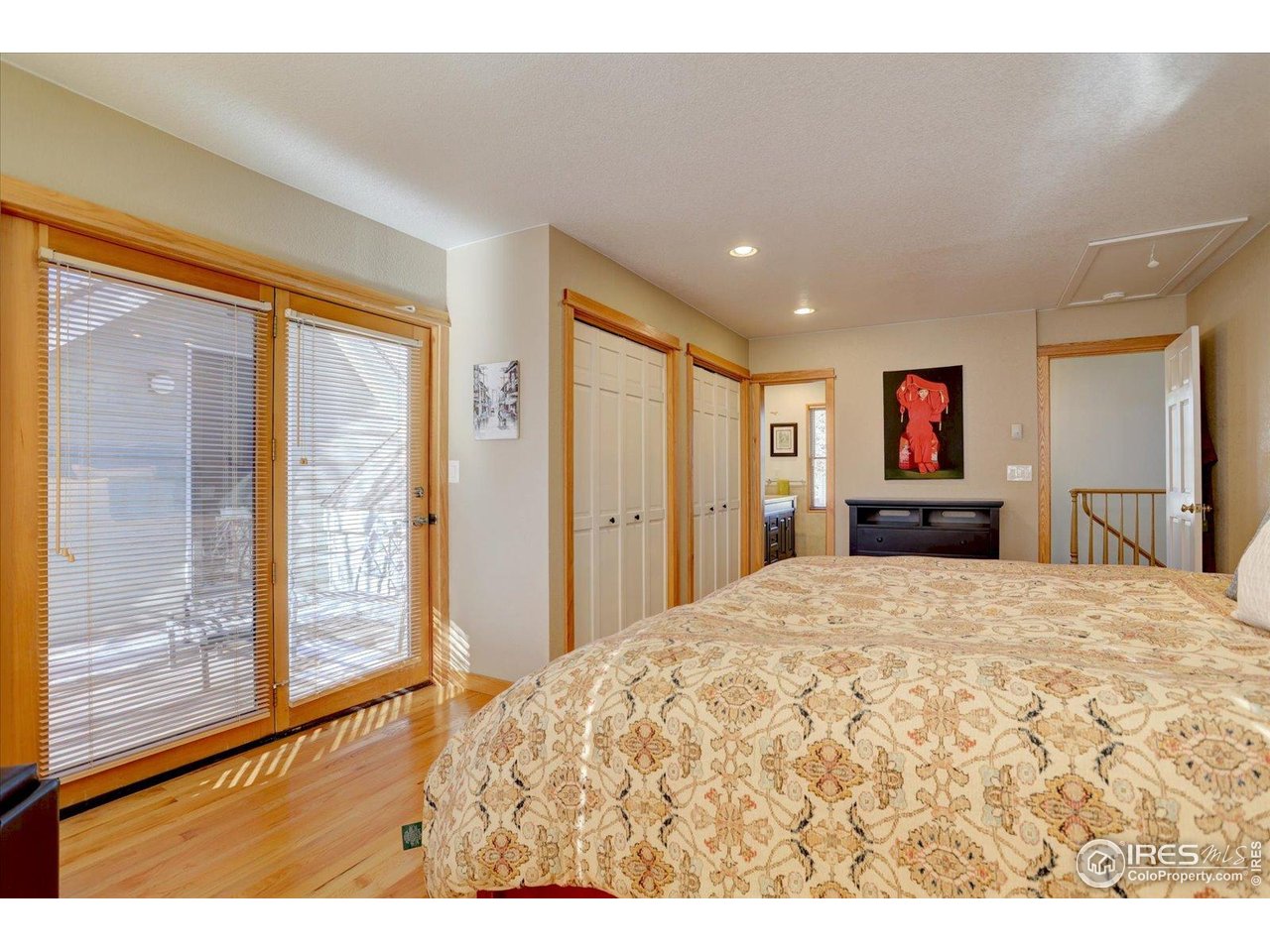 815 16th Street Boulder, CO 80302 - Photo 18 of 47 a large bedroom with a large bed and large window