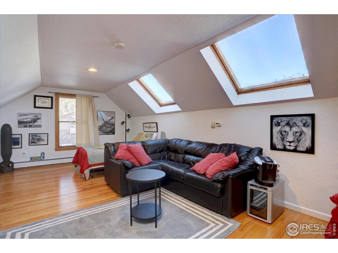 815 16th Street Boulder, CO 80302 - Photo 22 of 47 a living room with furniture and a wooden floor