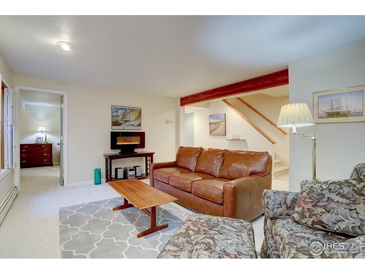815 16th Street Boulder, CO 80302 - Photo 29 of 47 a living room with furniture and a wooden floor