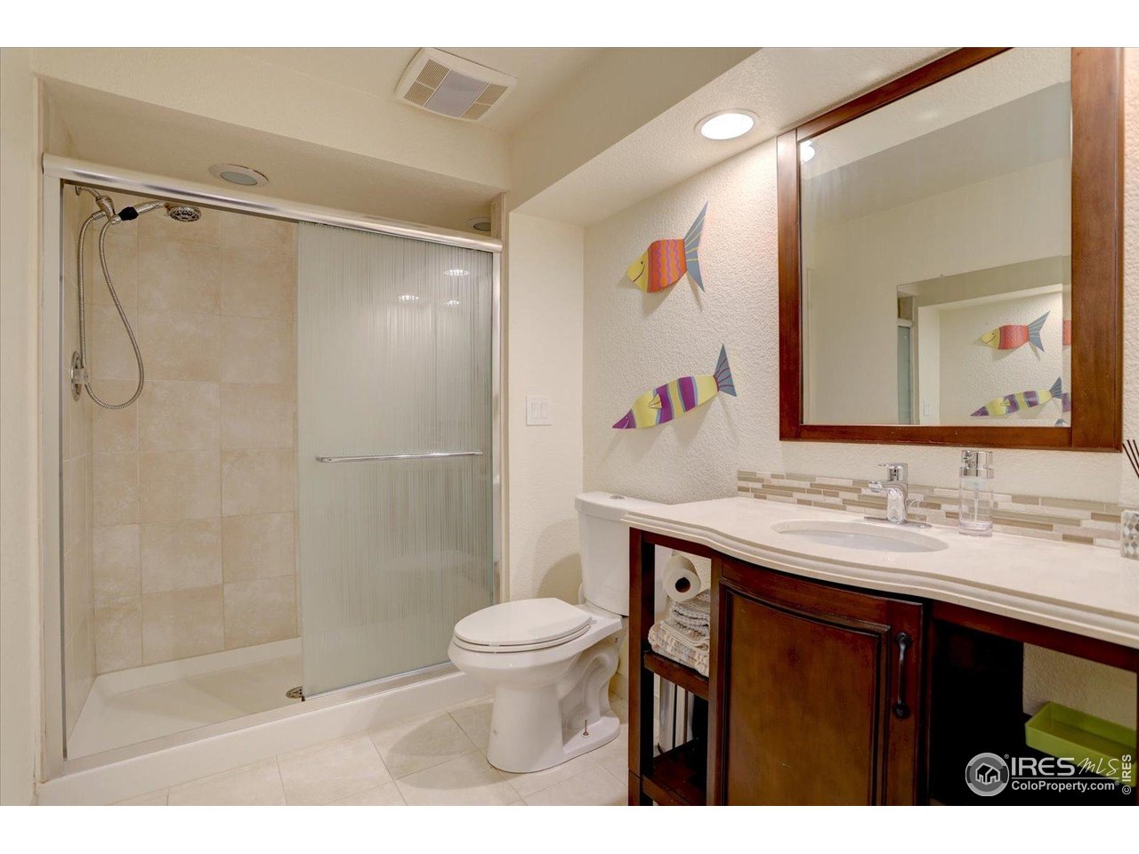 815 16th Street Boulder, CO 80302 - Photo 32 of 47 a bathroom with a sink vanity toilet and shower
