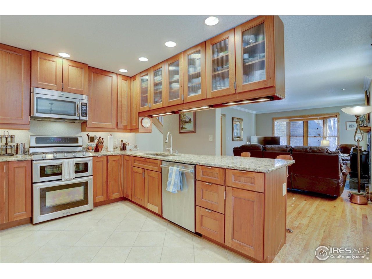 815 16th Street Boulder, CO 80302 - Photo 7 of 47 a kitchen with stainless steel appliances granite countertop a stove a sink and a microwave