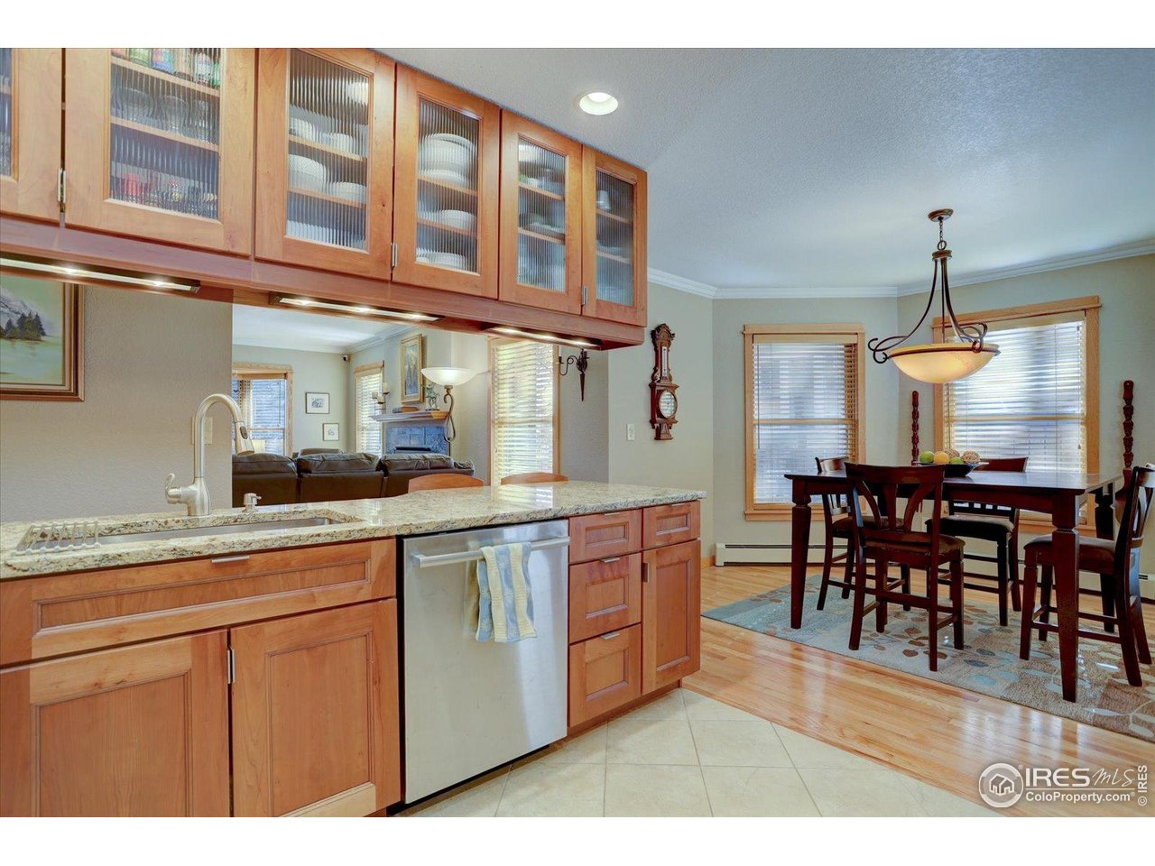 815 16th Street Boulder, CO 80302 - Photo 10 of 47 a kitchen with cabinets a sink dining table and chairs